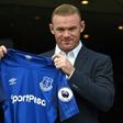 Wayne Rooney poses with the Everton shirt after his return to the club from Manchester United