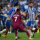 Manchester City's Bernardo Silva (R) runs with the ball during their English Premier League match against Brighton & Hove Albion, at the American Express Community Stadium in Brighton, on August 12, 2017