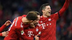 Bayern Munich's Polish striker Robert Lewandowski (R), who scored their first two goals, celebrates after Franck Ribery netted a late third in Saturday's 3-0 win against Nuremberg to lift the defending champions to third in the league table.