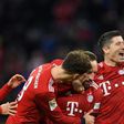 Bayern Munich's Polish striker Robert Lewandowski (R), who scored their first two goals, celebrates after Franck Ribery netted a late third in Saturday's 3-0 win against Nuremberg to lift the defending champions to third in the league table.