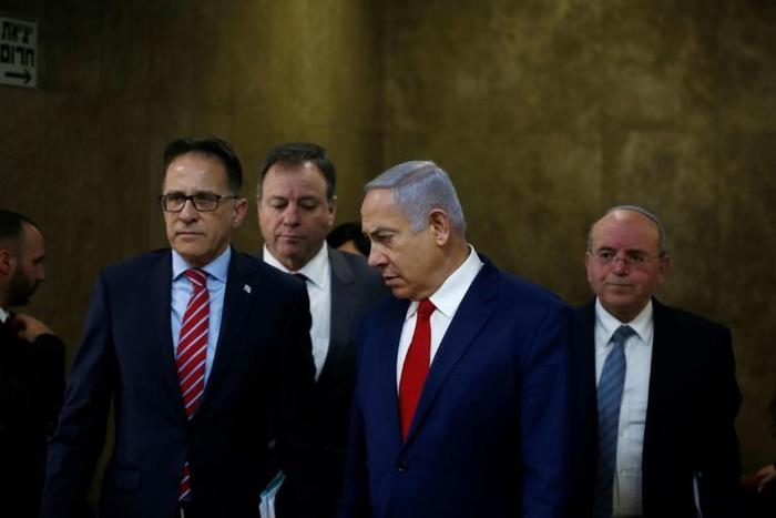 Israeli Prime Minister Benjamin Netanyahu (2nd-R) arrives for the weekly cabinet meeting at the Prime Minister's office in Jerusalem on December 23, 2018