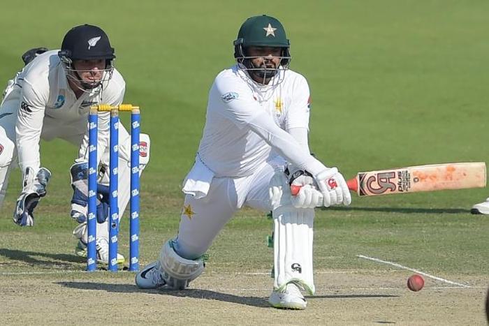 Pakistani batsman Azhar Ali (R) plays a shot against New Zealand December 5, 2018