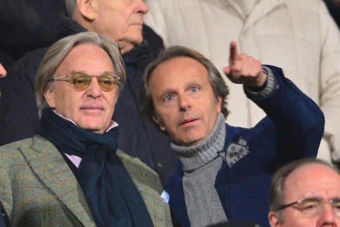 Fiorentina owners Diego (L) and Andrea Della Valle watch the Italian Serie A match against Inter Milan at the Artemio Franchi Stadium in Florence on February 17, 2013