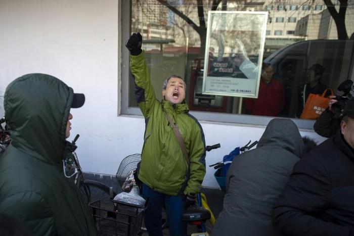 Yang Chunlin, a rights activist from Heilongjiang, was detained after protesting outside the courthouse