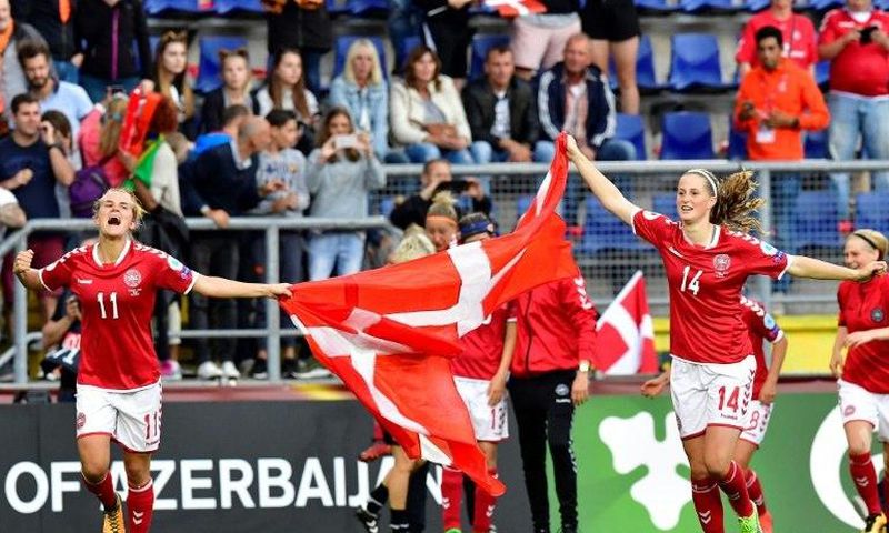 Denmark's players celebrate after winning the UEFA Women’s Euro 2017 football tournament semi-final match between Denmark and Austria at the Rat Verlegh Stadium, in Breda, on August 3, 2017