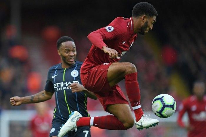 Liverpool defender Joe Gomez (right) faces a lengthy spell on the sidelines after a leg fracture