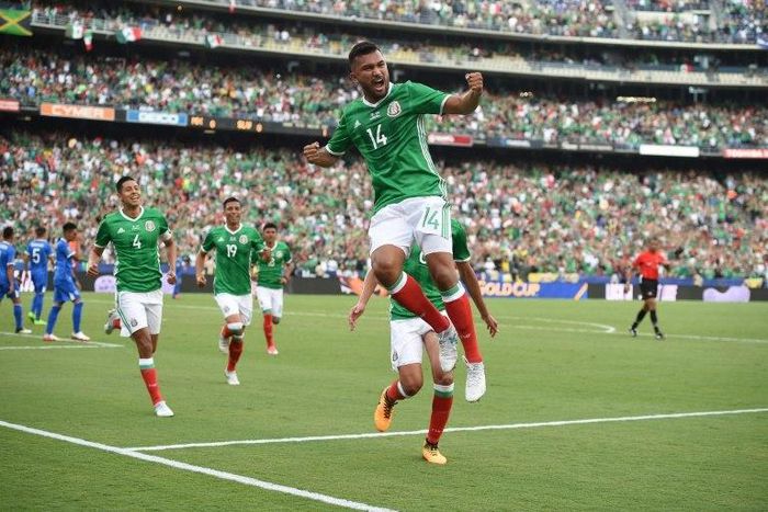 Hedgardo Marin (C) celebrates the opening goal as Mexico beat El Salvador 3-1 in the Group C opener of the CONCACAF Gold Cup