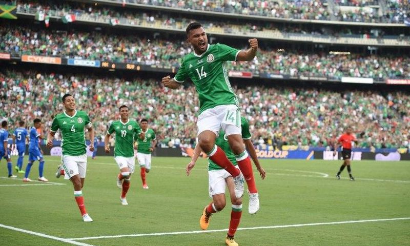 Hedgardo Marin (C) celebrates the opening goal as Mexico beat El Salvador 3-1 in the Group C opener of the CONCACAF Gold Cup
