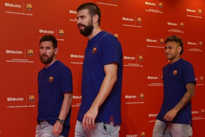 (From L) Barcelona players Lionel Messi, Gerard Pique, and Neymar arrive at a team event in Tokyo on July 13, 2017, following a press conference to announce new sponsorship with Japanese internet retailer Rakuten