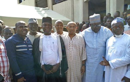 CAF President Ahmad recites Qur'an in the company of Nyantakyi in the mosque