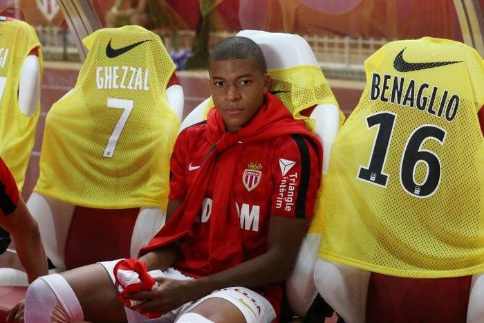 Monaco's forward Kylian Mbappe sits on the bench at the start of the French L1 football match against Marseille August 27, 2017