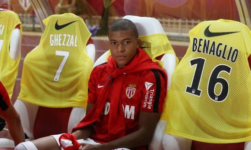 Monaco's forward Kylian Mbappe sits on the bench at the start of the French L1 football match against Marseille August 27, 2017