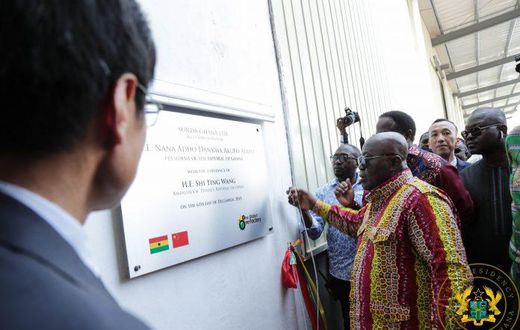 President Akufo-Addo unveils the plaque for the commissioning of the diaper making factory