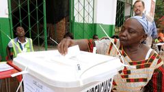 A woman casts her ballot to vote in the second round of the presidential election on May 18, 2014 in Guinea-Bissau; the country will hold a legislative election March 10, 2019