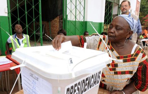 A woman casts her ballot to vote in the second round of the presidential election on May 18, 2014 in Guinea-Bissau; the country will hold a legislative election March 10, 2019