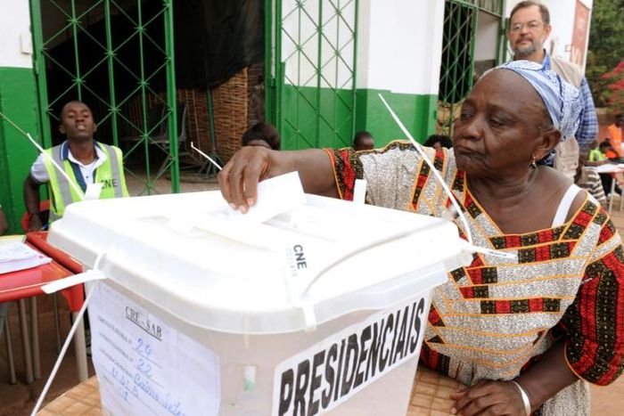 A woman casts her ballot to vote in the second round of the presidential election on May 18, 2014 in Guinea-Bissau; the country will hold a legislative election March 10, 2019