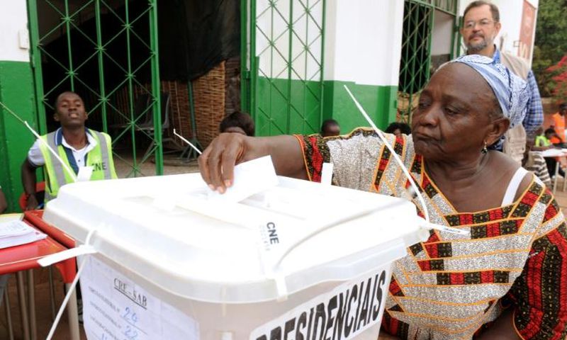 A woman casts her ballot to vote in the second round of the presidential election on May 18, 2014 in Guinea-Bissau; the country will hold a legislative election March 10, 2019