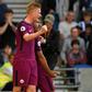 Manchester City's striker Sergio Aguero (2nd L) celebrates with midfielders Kevin De Bruyne (L) and Fernandinho (R) at the American Express Community Stadium in Brighton, southern England on August 12, 2017
