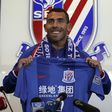 Argentine striker Carlos Tevez posing with a jersey of his new club Shanghai Shenhua during a press conference in Shanghai, on January 21, 2017