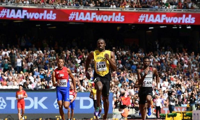 Jamaica's Usain Bolt (C) race to victory on the anchor leg ahead of Canada's Mobolade Ajomale (R) and Cuba's Jose Luis Gaspar to win their heat in the 4x100m relay at the IAAF World Championships at the London Stadium in London, on August 12, 2017