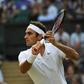 Switzerland's Roger Federer returns against Germany's Mischa Zverev at Wimbledon on July 8, 2017