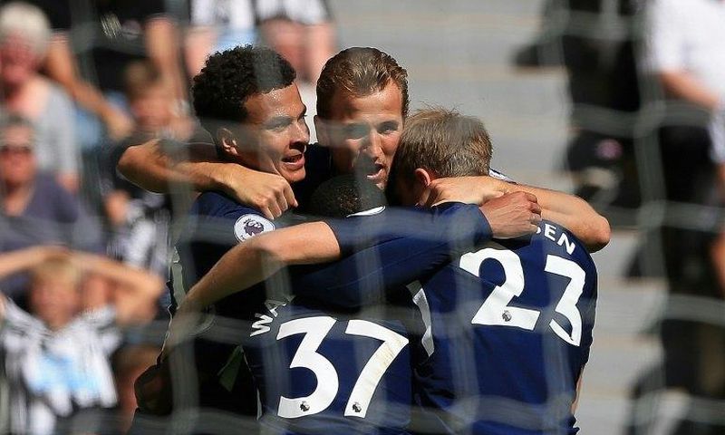 Tottenham's English midfielder Dele Alli (L) celebrates scoring the opening goal during the English Premier League match against Newcastle at St James' Park in Newcastle-upon-Tyne, northeast England on August 13, 2017