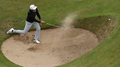 China's Li Haotong fails to get out of a bunker on the 12th hole on July 21, 2017