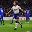 Tottenham Hotspur remain in the title race after a 3-0 victory over Cardiff City England striker Harry Kane scoring for the fifth successive time on New Year's Day