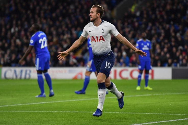 Tottenham Hotspur remain in the title race after a 3-0 victory over Cardiff City England striker Harry Kane scoring for the fifth successive time on New Year's Day