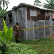 Nigerian drug enforcement officials guard a methamphetamine lab in the village of Obinugwu in the southeast of the country