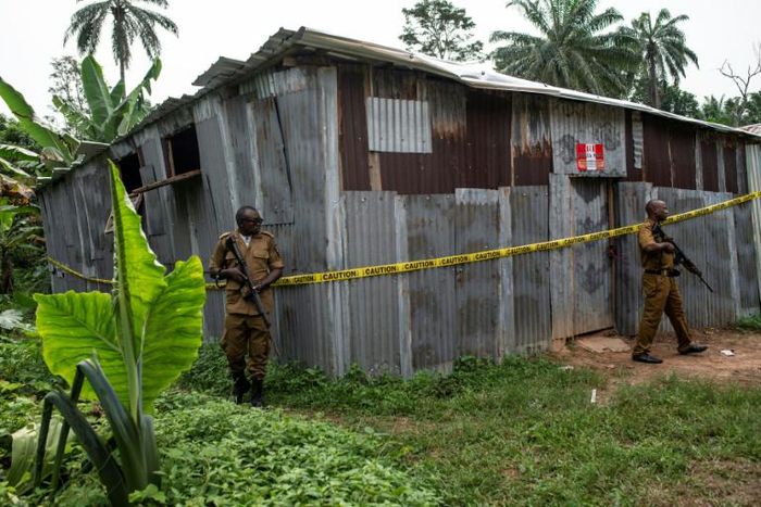 Nigerian drug enforcement officials guard a methamphetamine lab in the village of Obinugwu in the southeast of the country