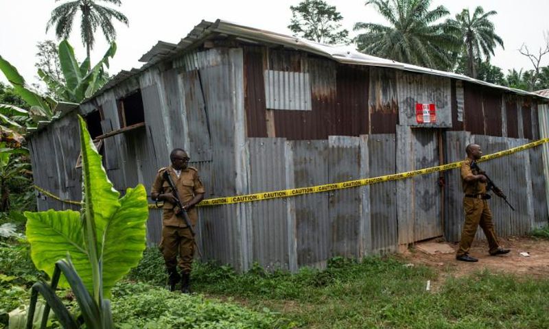 Nigerian drug enforcement officials guard a methamphetamine lab in the village of Obinugwu in the southeast of the country
