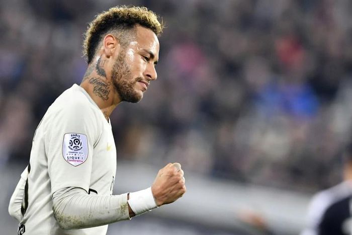 Paris Saint-Germain's Neymar celebrates scoring his 11th league goal of the season against Bordeaux before leaving the field through injury