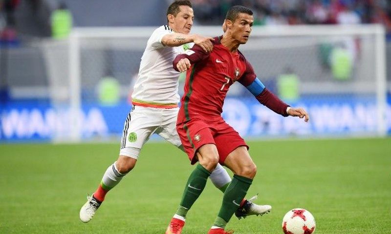 Portugal's forward Cristiano Ronaldo (R) clashes with Mexico's midfielder Andres Guardado during the 2017 Confederations Cup on June 18, 2017