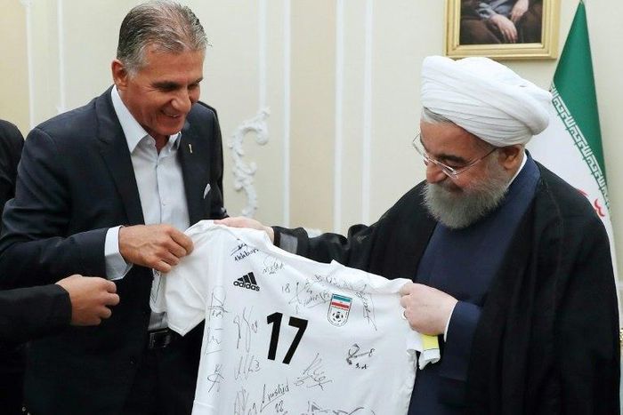 Football coach Carlos Queiroz (L) meets President Hassan Rouhani after taking the Iran team through to the Russia 2018 World Cup