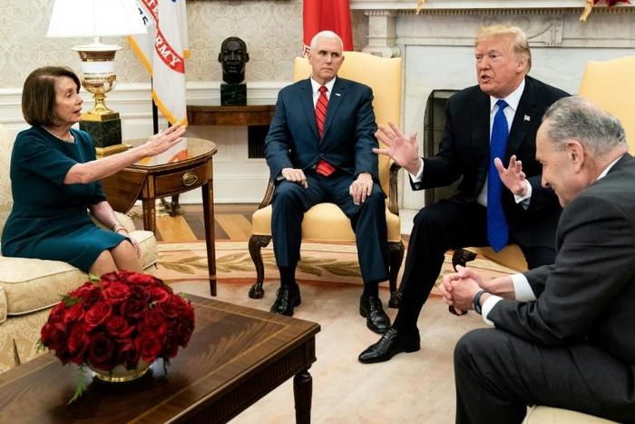 President Donald Trump and Vice President Mike Pence took part in a heated exchange with House Minority Leader Nancy Pelosi and Senate Minority Leader Chuck Schumer at the White House on December 11, 2018