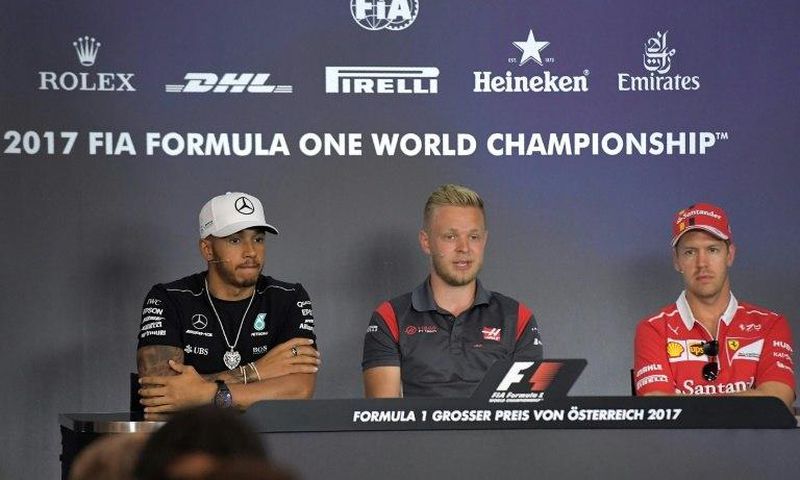 (From L) Mercedes' British driver Lewis Hamilton, Haas F1's Danish driver Kevin Magnussen and Ferrari's German driver Sebastian Vettel attend a driver's press conference ahead of the Austrian Formula One Grand Prix in Spielberg on July 6, 2017.