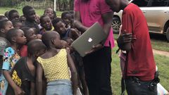 John Dumelo educating some children