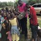 John Dumelo educating some children