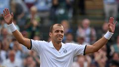 Luxembourg's Gilles Muller acknowledges the Centre Court crowd after beating Spain's Rafael Nadal at Wimbledon on July 10, 2017
