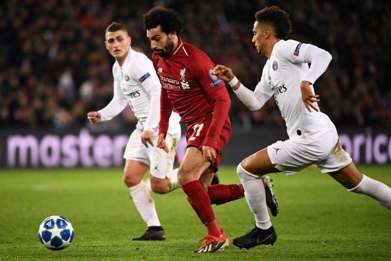 Mohamed Salah tries to escape the attentions of Marco Verratti and Thilo Kehrer in Liverpool's 2-1 defeat in Paris