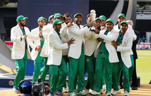 Pakistan's Sarfraz Ahmed (3rdR) lifts the trophy as Pakistan players celebrate their win at the ICC Champions Trophy on June 18, 2017