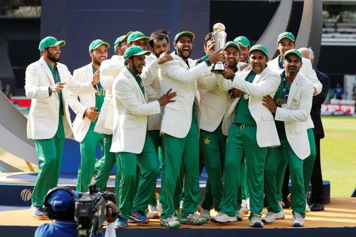 Pakistan's Sarfraz Ahmed (3rdR) lifts the trophy as Pakistan players celebrate their win at the ICC Champions Trophy on June 18, 2017