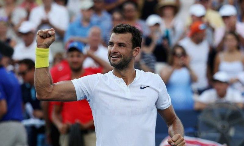 Grigor Dimitrov of Bulgaria celebrates after defeating Nick Kyrgios of Australia to win the Cincinnati Masters