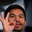 Manny Pacquiao touched down in Brisbane late Saturday from Manila with a large entourage for his World Boxing Organization welterweight title bout at Suncorp Stadium next weekend