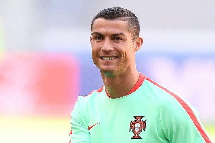 Portugal's Cristiano Ronaldo smiles during a training session on the eve of the Confederations Cup match against Mexico in the Russian city of Kazan