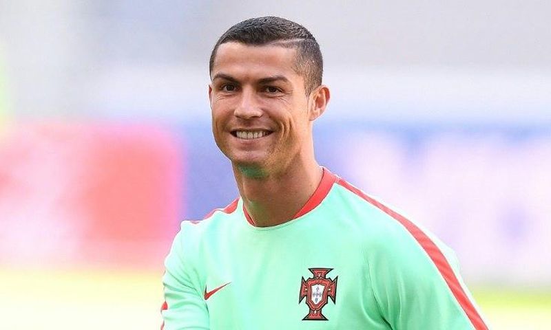 Portugal's Cristiano Ronaldo smiles during a training session on the eve of the Confederations Cup match against Mexico in the Russian city of Kazan