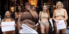 Plus-size women strip to their bikini to protest against Victoria's Secret