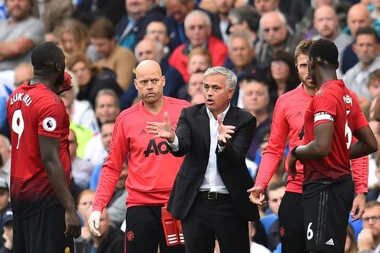 Romelu Lukaku (left) and Paul Pogba (right) have been routinely dropped by Jose Mourinho (centre) this season