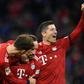 Bayern Munich's Polish striker Robert Lewandowski (R), who scored their first two goals, celebrates after Franck Ribery netted a late third in Saturday's 3-0 win against Nuremberg to lift the defending champions to third in the league table.